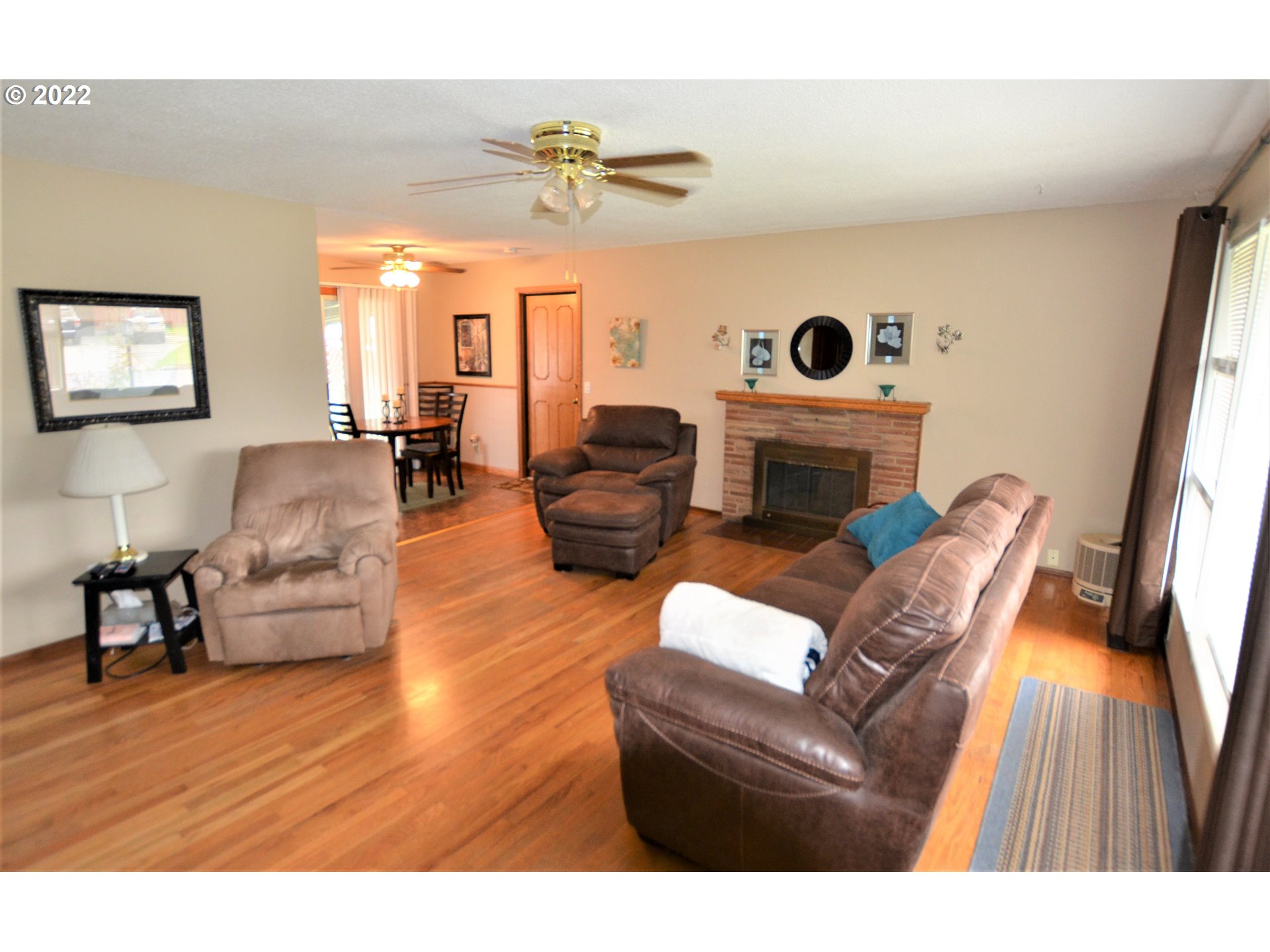 1585 Southwest 40th Street Pendleton, OR 97801 - Photo 13 of 20 a living room with furniture and a fireplace