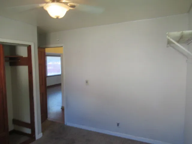 an empty room with a bathroom