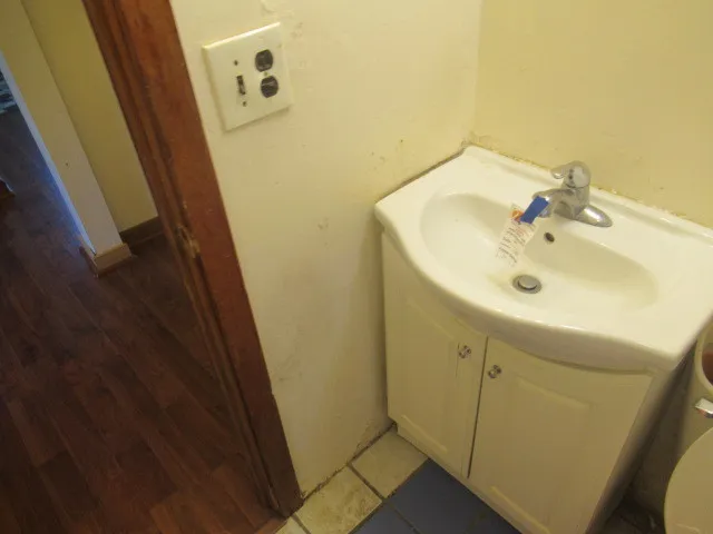 a bathroom with a sink and mirror