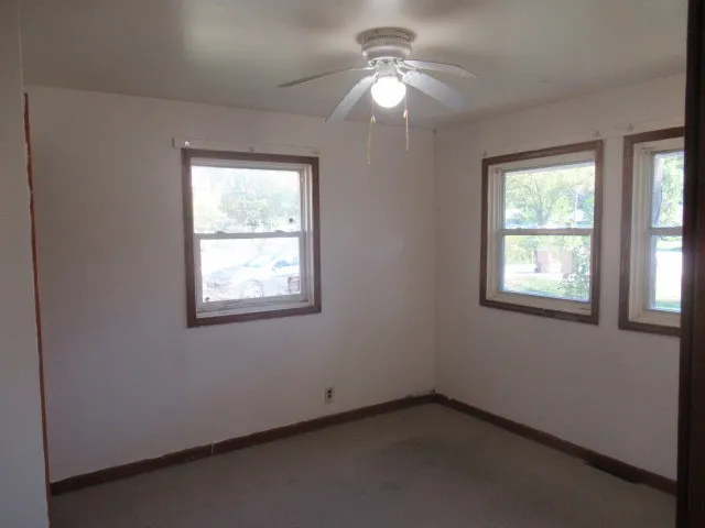 a view of an empty room with a window