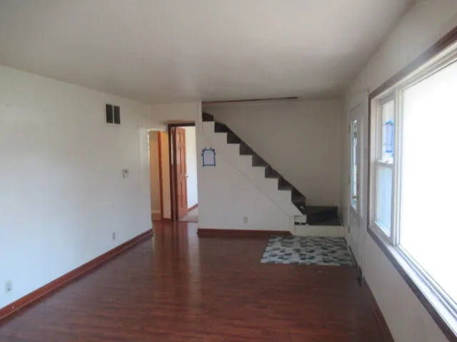 a view of entryway with wooden floor