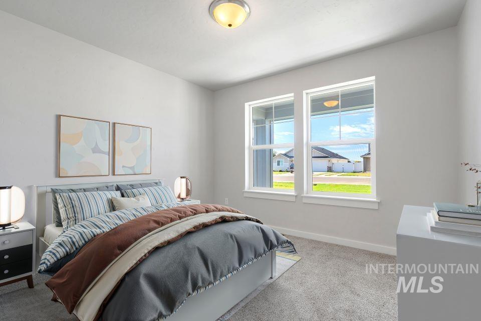 1340 Dawn Street Weiser, ID 83672 - Photo 22 of 32 Bedroom featuring baseboards and light colored carpet