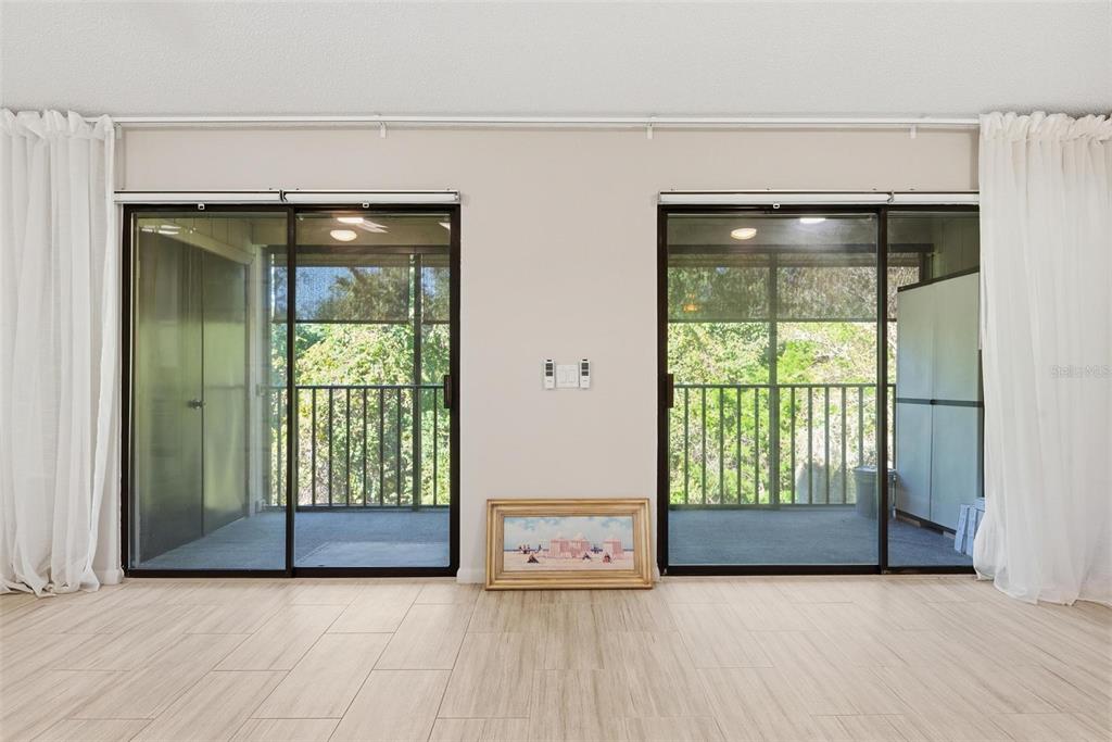 32 Navarra Court St. Augustine, FL 32086 - Photo 24 of 51 an empty room with floor to ceiling window and an outdoor view