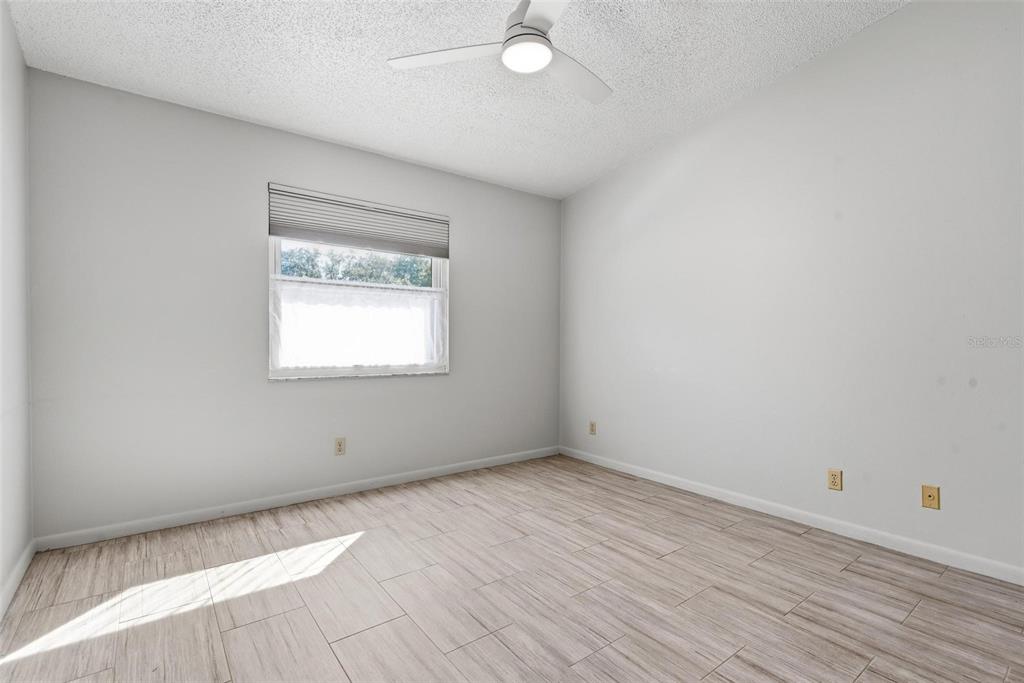 32 Navarra Court St. Augustine, FL 32086 - Photo 27 of 51 an empty room with wooden floor and windows