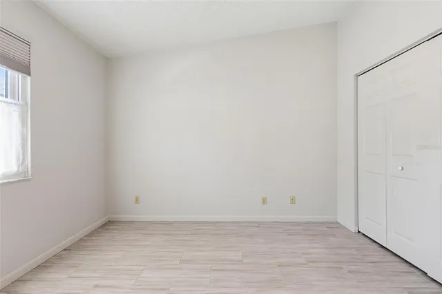 a bathroom with a sink shower and a mirror