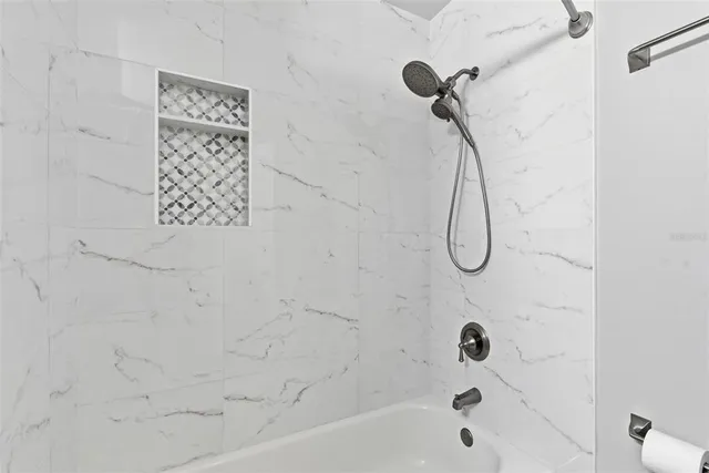 a park view with a bench and garden