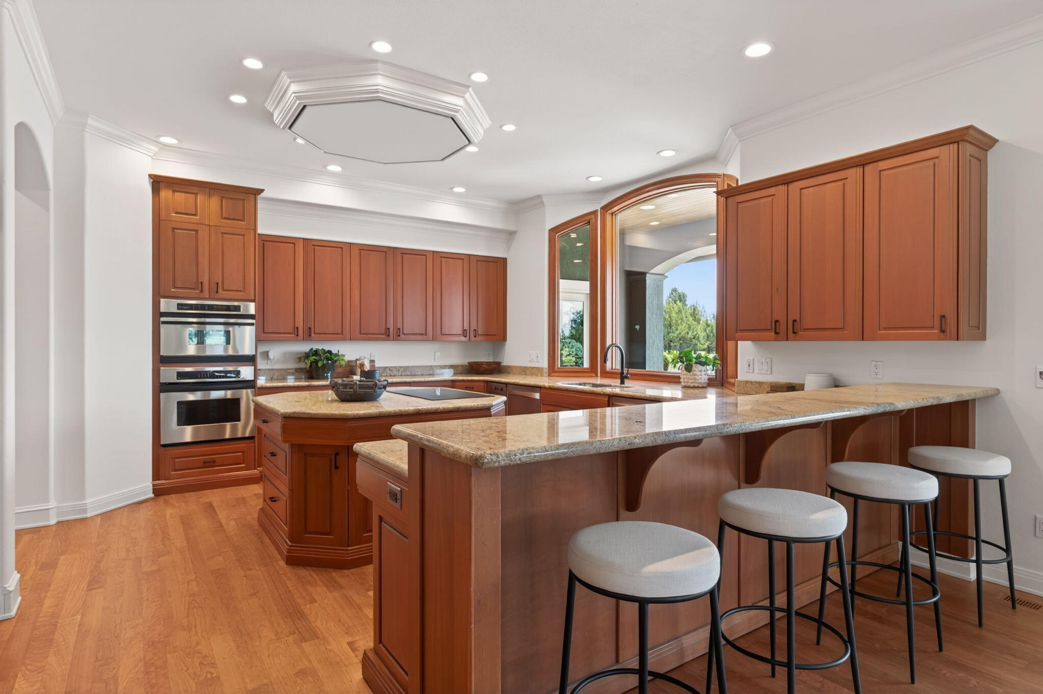 20180 Winston Loop Bend, OR 97703 - Photo 12 of 59 a kitchen with stainless steel appliances granite countertop a sink and a refrigerator