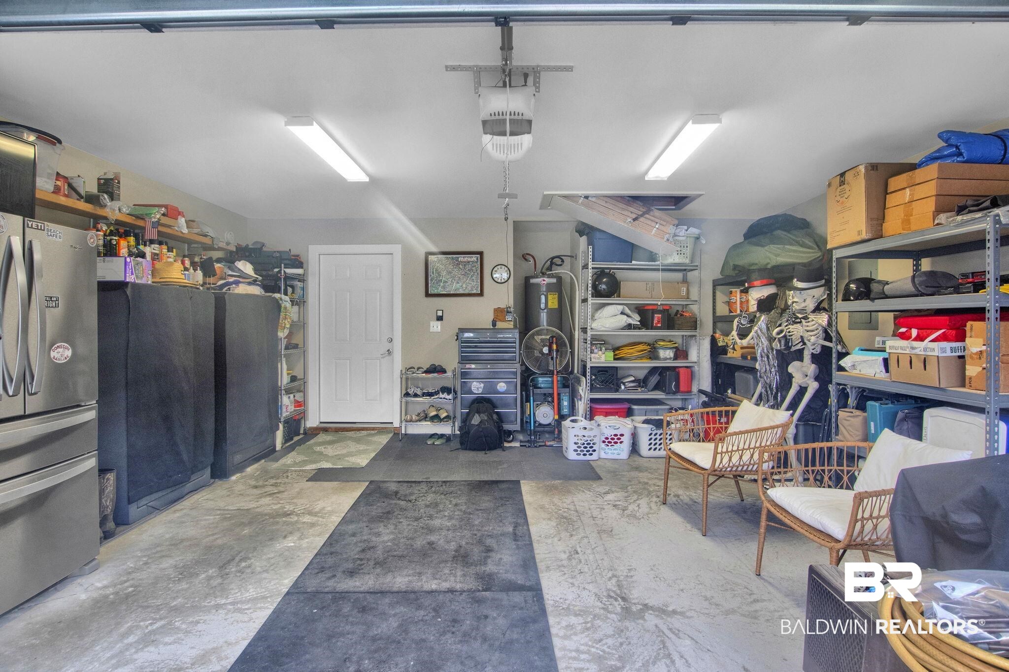 203 Lakefront Circle Summerdale, AL 36580 - Photo 52 of 69 Garage featuring a garage door opener