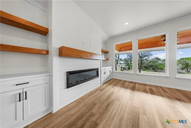 a view of kitchen with kitchen island granite countertop living room