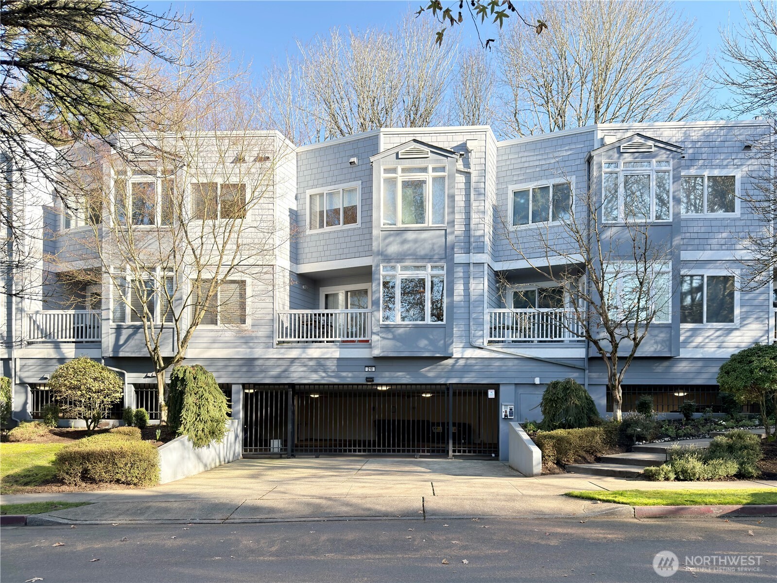 a view of building with cars parked