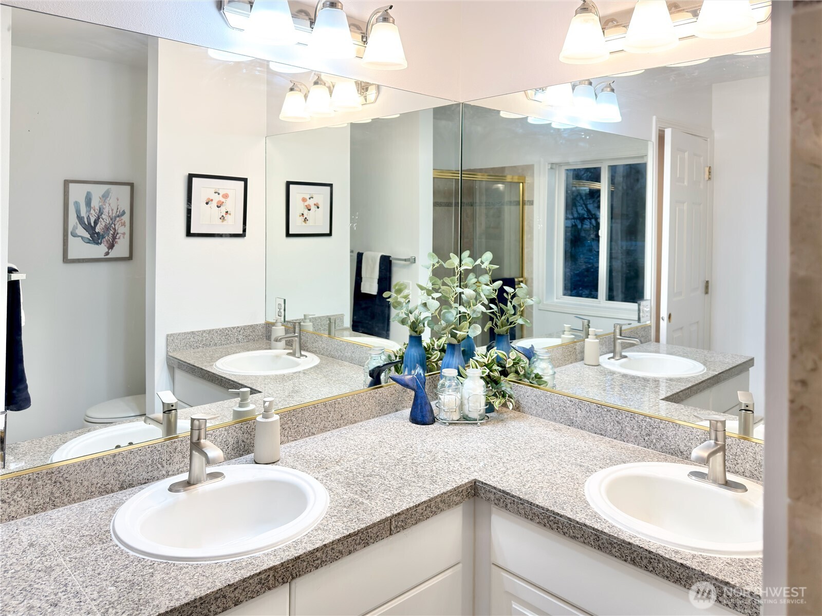 210 10th Street, Unit 4 Kirkland, WA 98033 - Photo 20 of 35 a bathroom with a granite countertop sink and a mirror