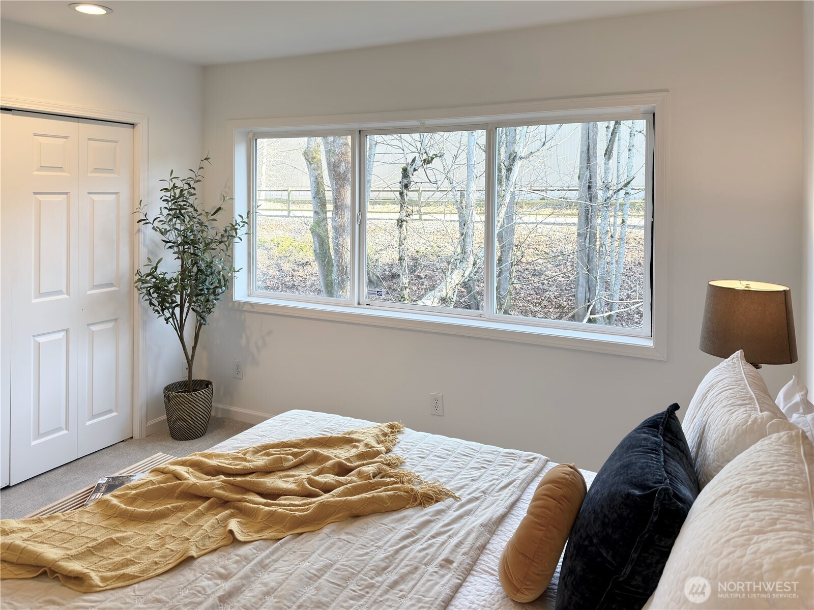 210 10th Street, Unit 4 Kirkland, WA 98033 - Photo 24 of 35 a bedroom with a bed and a window