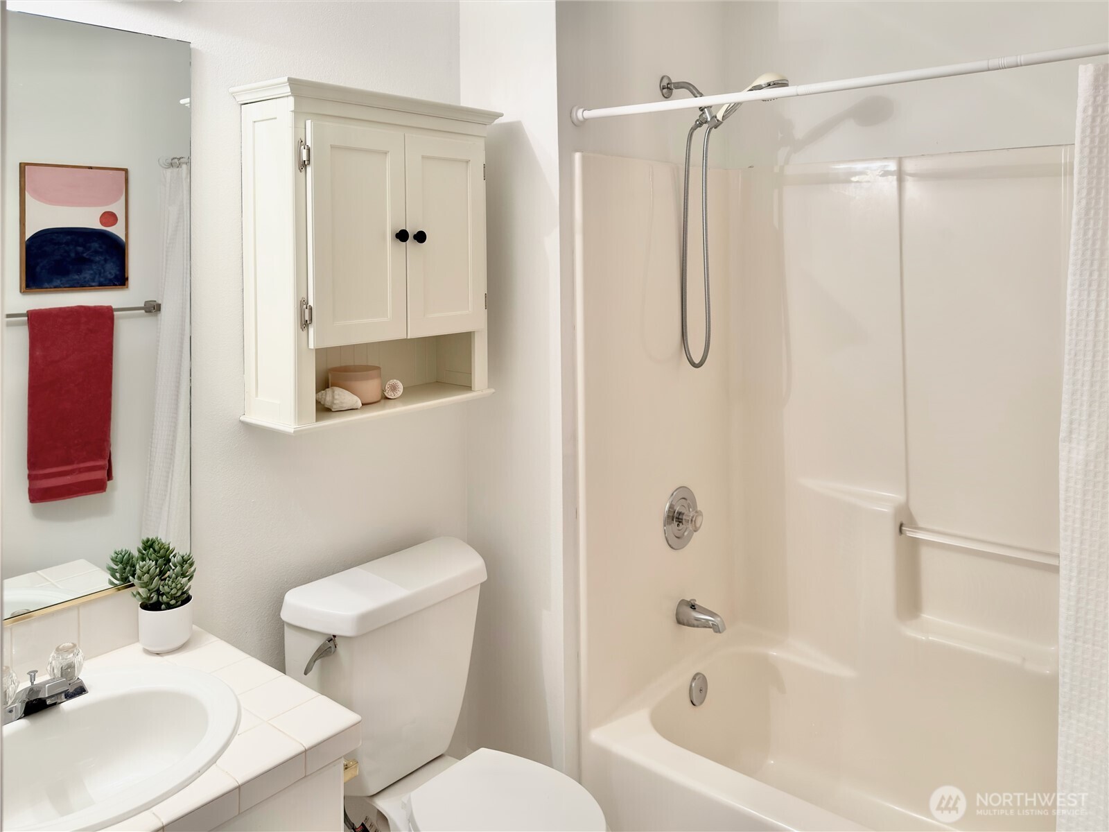 210 10th Street, Unit 4 Kirkland, WA 98033 - Photo 26 of 35 a bathroom with a sink toilet and shower