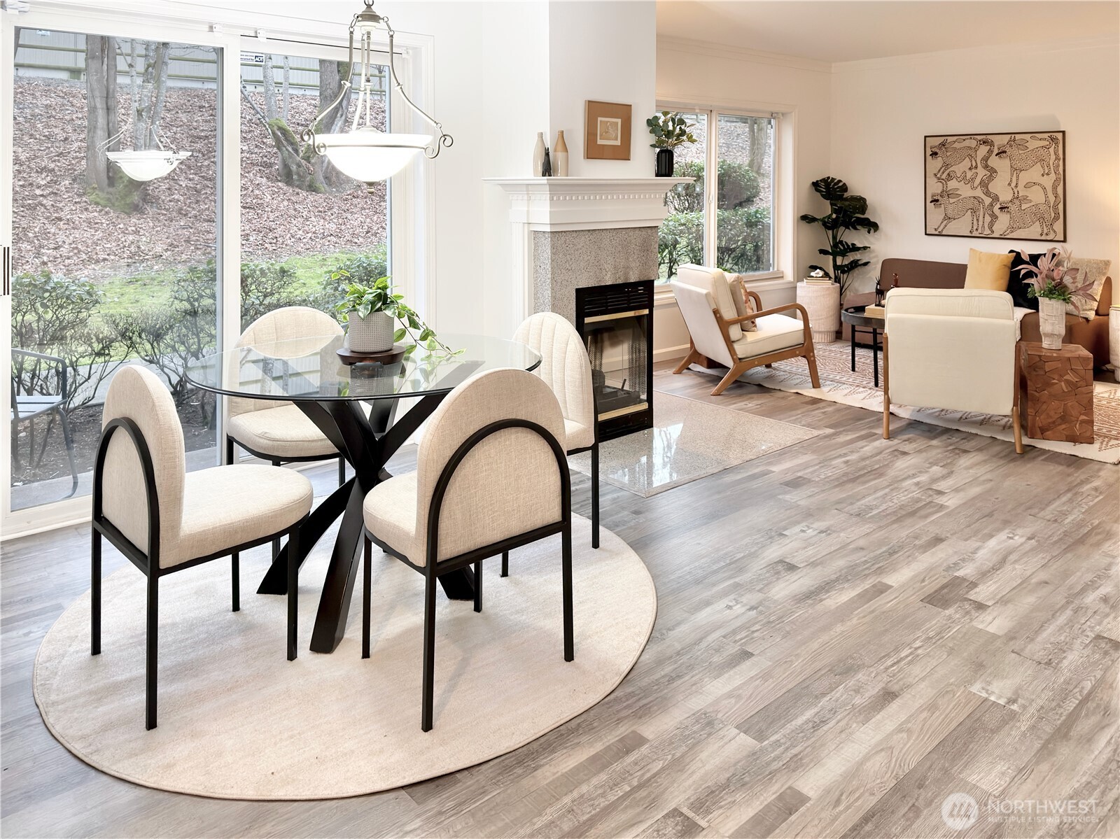 210 10th Street, Unit 4 Kirkland, WA 98033 - Photo 3 of 35 a living room with furniture a fireplace and a floor to ceiling window