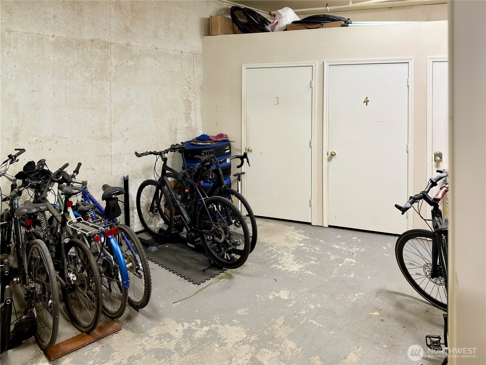 210 10th Street, Unit 4 Kirkland, WA 98033 - Photo 32 of 35 a view of a room with rack on the wall