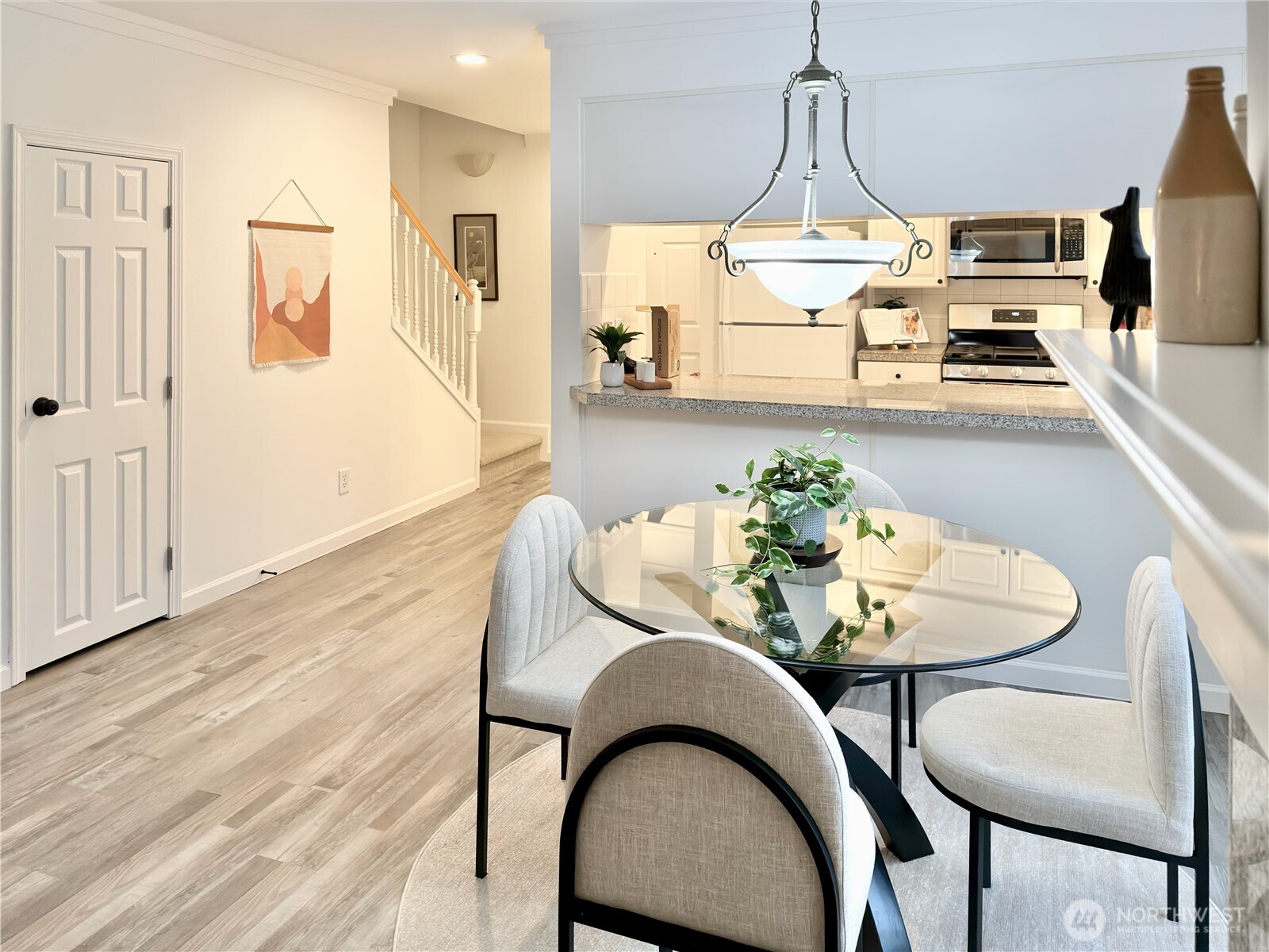 210 10th Street, Unit 4 Kirkland, WA 98033 - Photo 6 of 35 a dining room with furniture and wooden floor