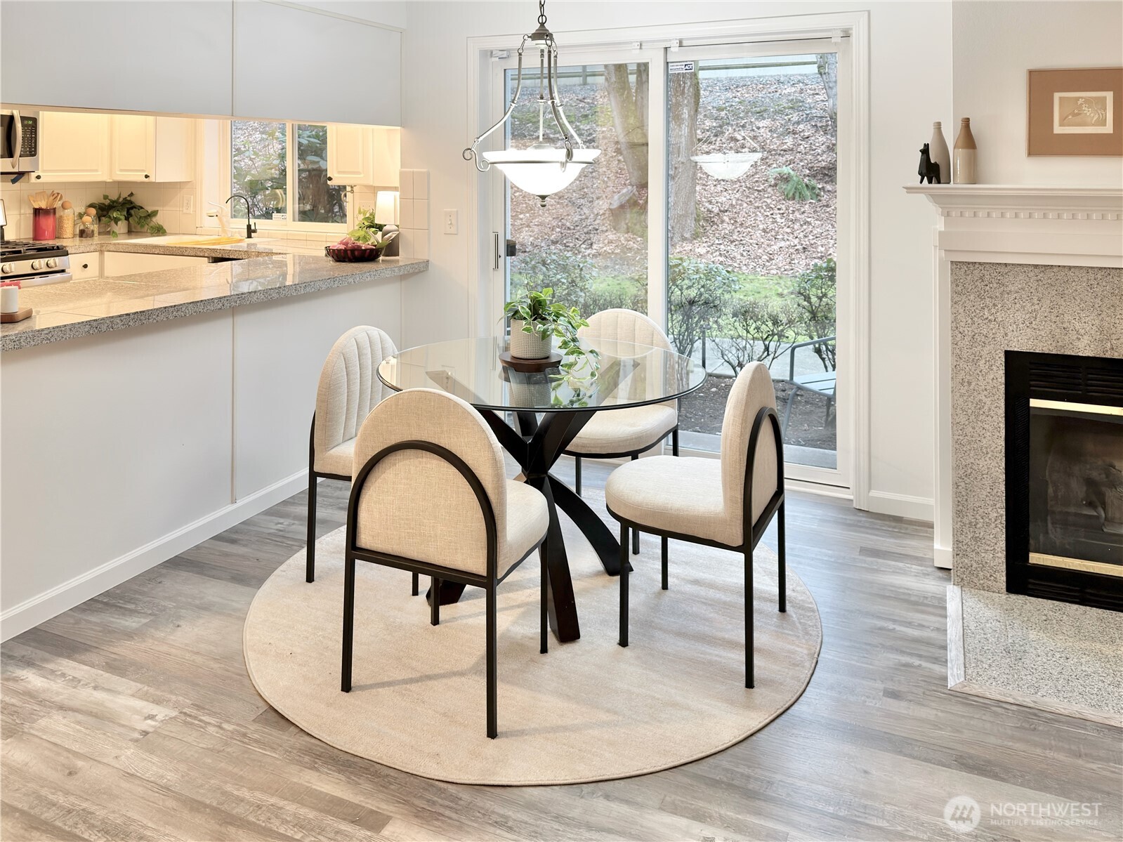 210 10th Street, Unit 4 Kirkland, WA 98033 - Photo 7 of 35 a living room with furniture a window and a fireplace
