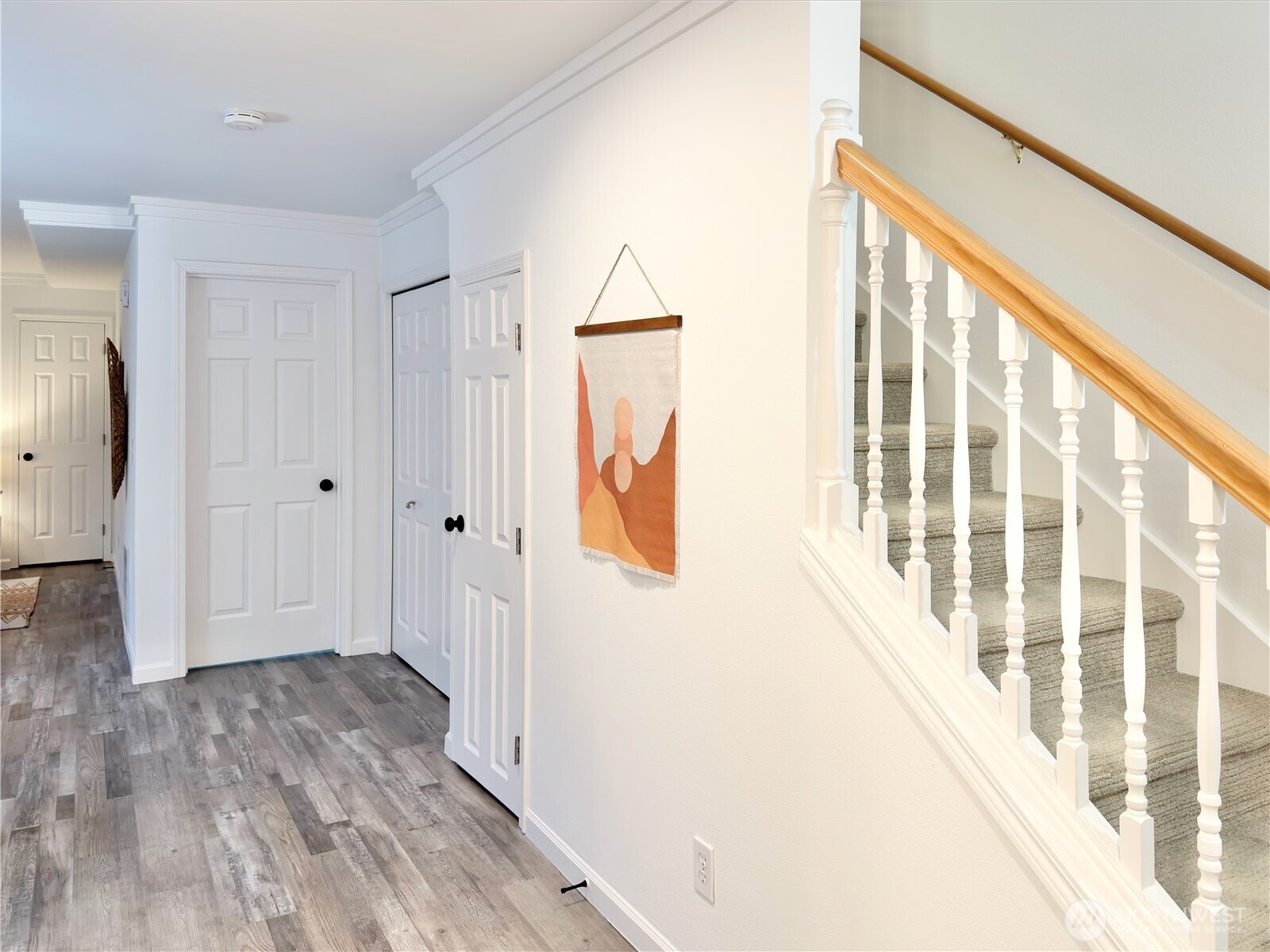 210 10th Street, Unit 4 Kirkland, WA 98033 - Photo 9 of 35 a view of hallway with wooden floor and stairs