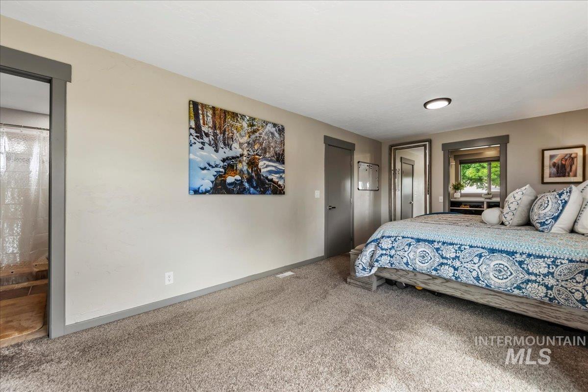 6323 Foothill Road Star, ID 83669 - Photo 18 of 50 Spacious room featuring neutral-toned walls, gray trim, and soft carpet flooring