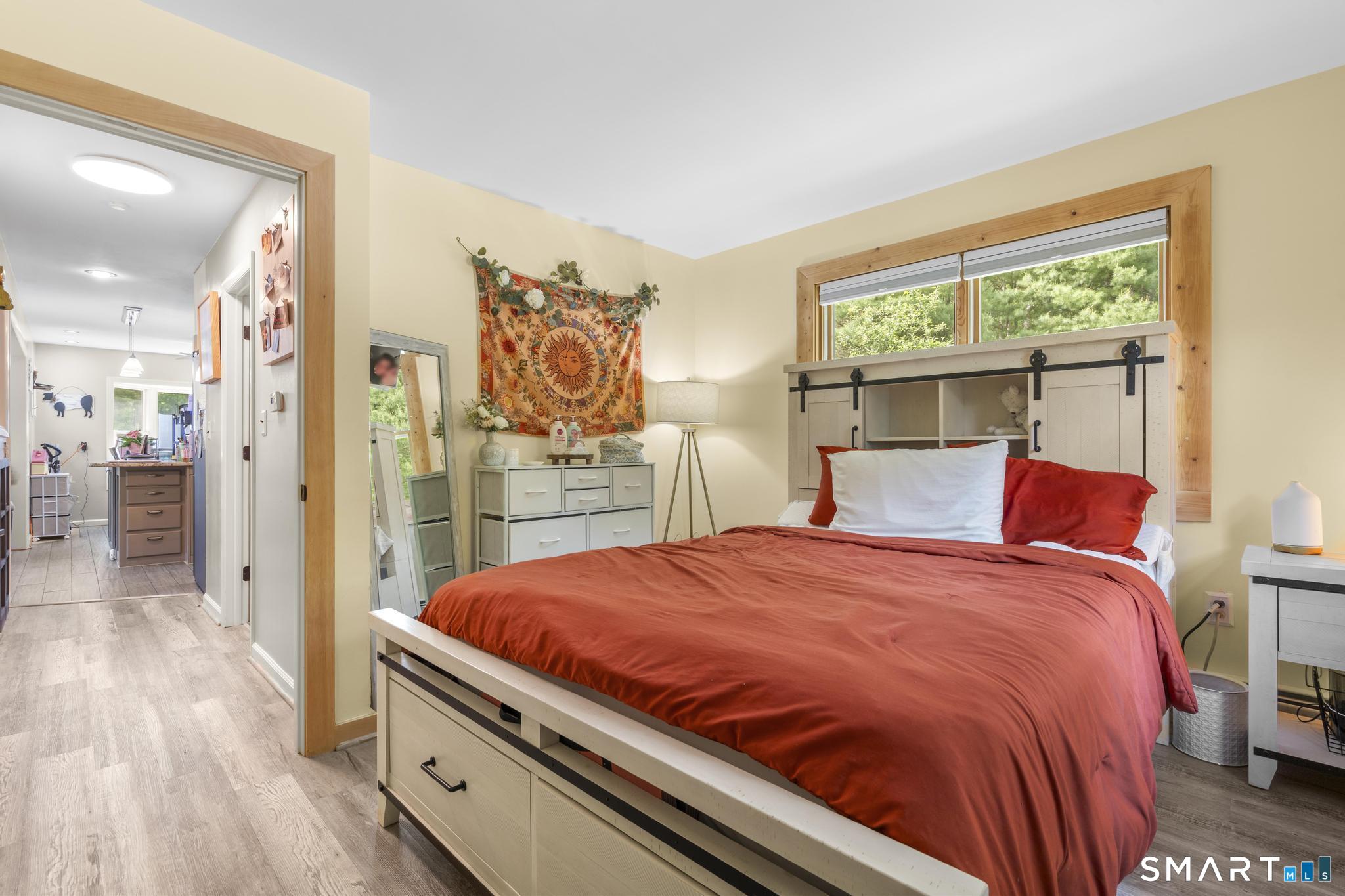 13 Christy Hill Road Ledyard, CT 06335 - Photo 19 of 38 a bed room with a bed and a view of kitchen