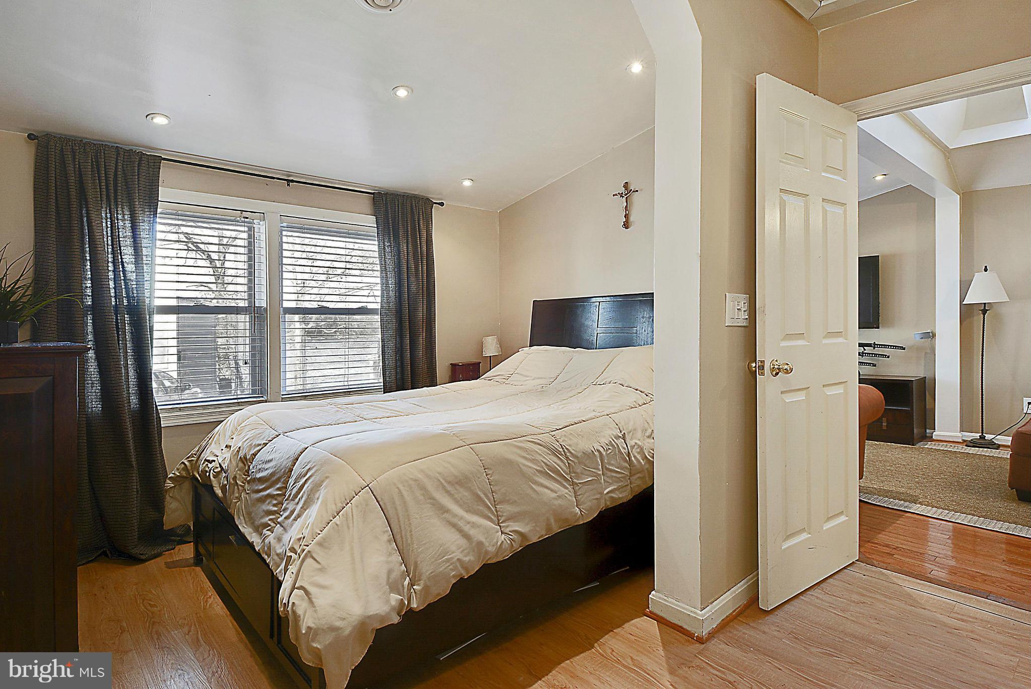 16 Butternut Road Riva, MD 21140 - Photo 8 of 25 a bedroom with a large bed and a chandelier