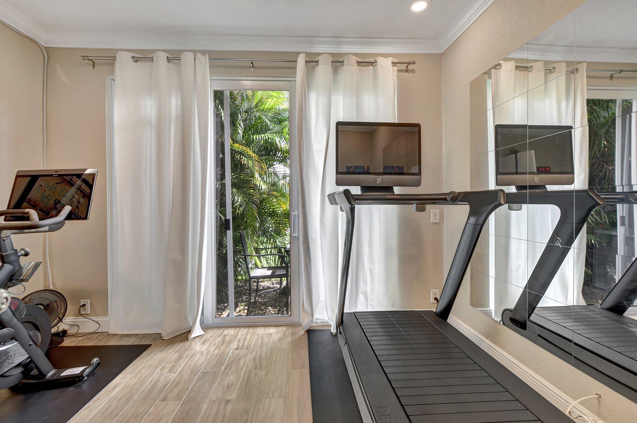 6682 Via Regina Boca Raton, FL 33433 - Photo 10 of 46 a view of a livingroom with furniture and a flat screen tv