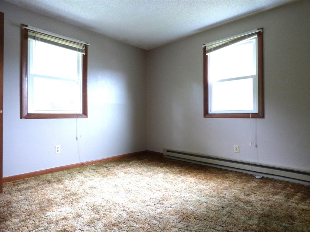 16-18 Daniel Street Springfield, MA 01151 - Photo 10 of 14 an empty room with a window