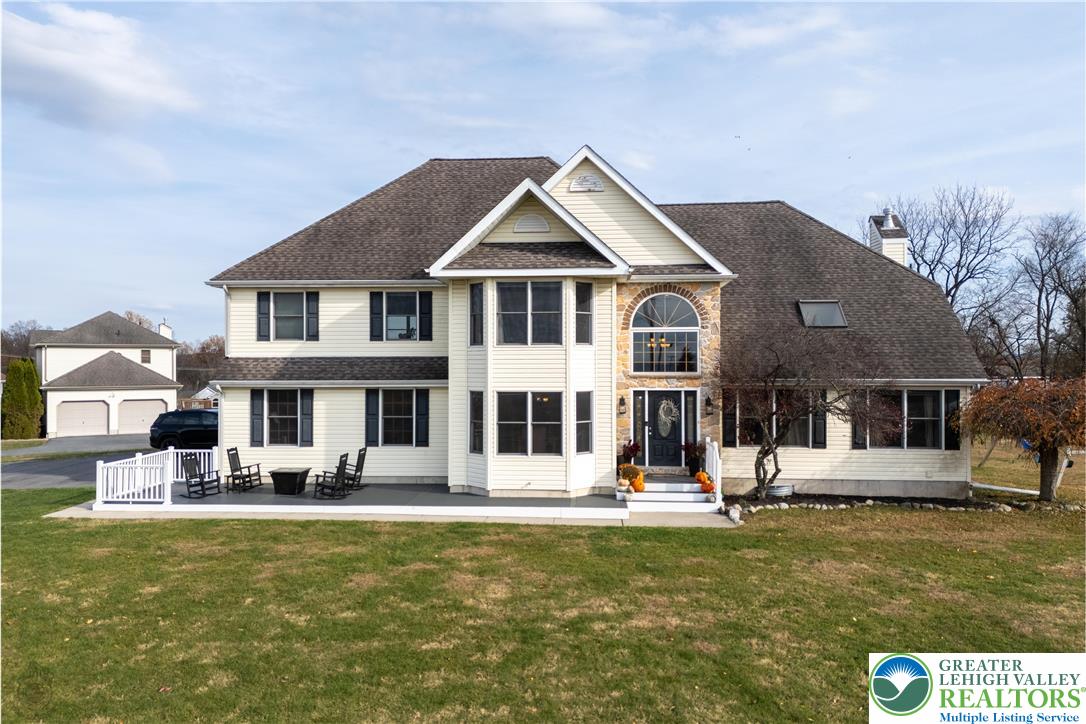 a front view of a house with garden