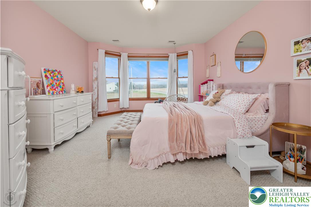 5 Farmstead Way Mount Bethel, PA 18343 - Photo 17 of 37 a spacious bedroom with a bed and a window