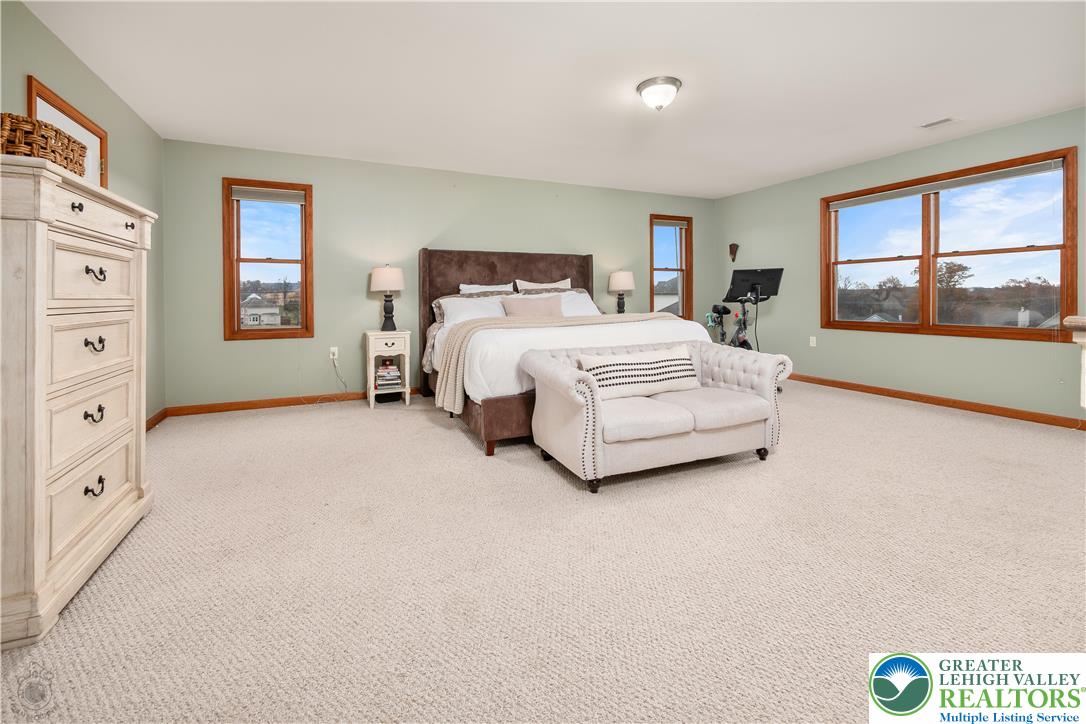 5 Farmstead Way Mount Bethel, PA 18343 - Photo 21 of 37 a spacious bedroom with a bed and a dresser next to a window