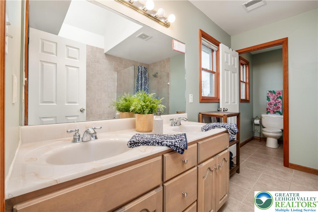 5 Farmstead Way Mount Bethel, PA 18343 - Photo 23 of 37 a bathroom with a granite countertop sink and a mirror