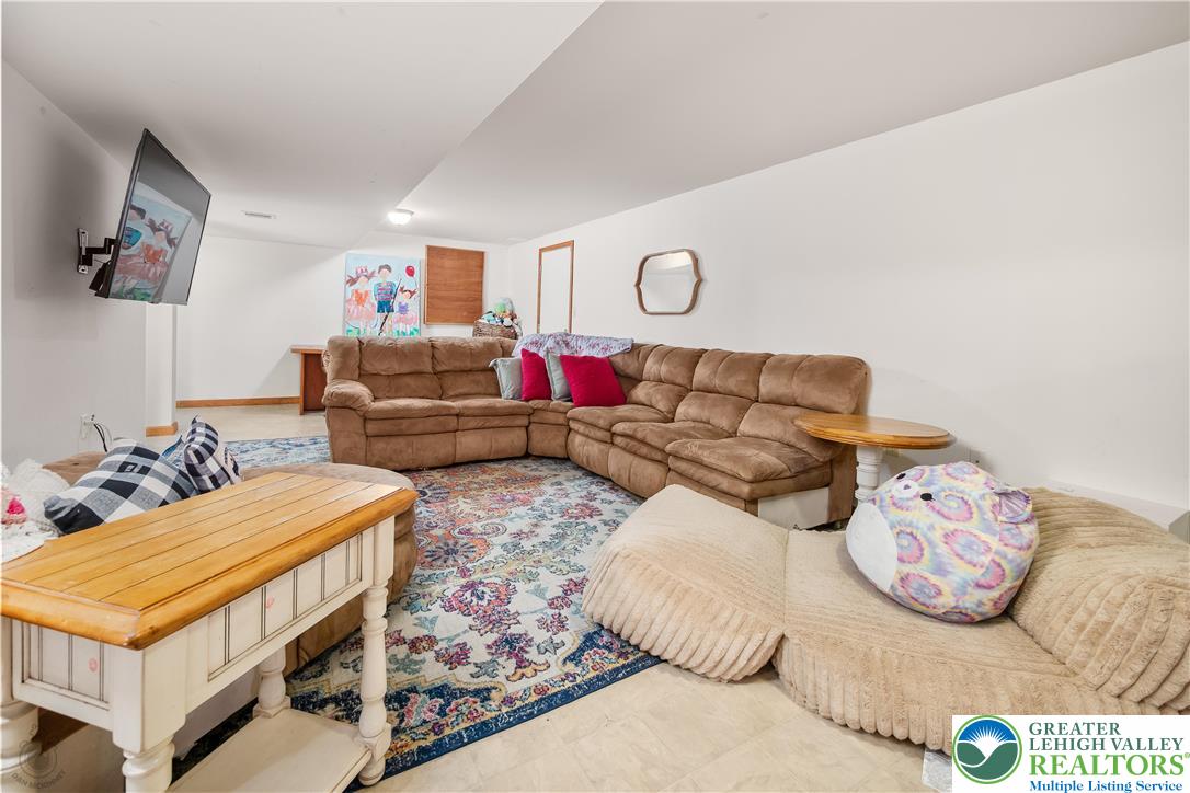 5 Farmstead Way Mount Bethel, PA 18343 - Photo 25 of 37 a living room with furniture and a table