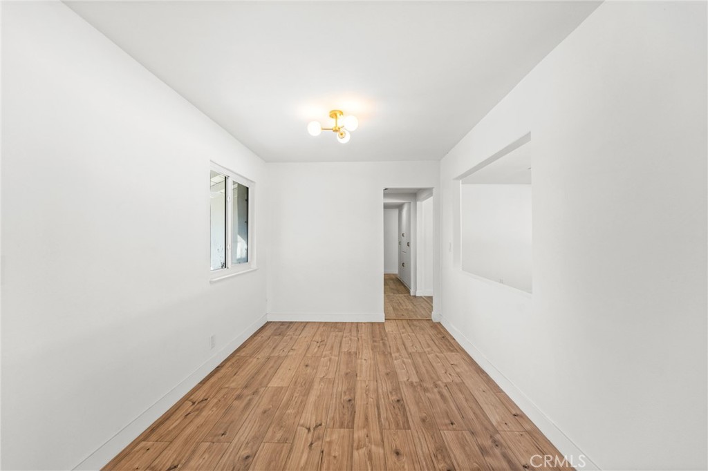 1423 Terrace Road Rialto, CA 92376 - Photo 12 of 40 a view of a room with wooden floor and a window