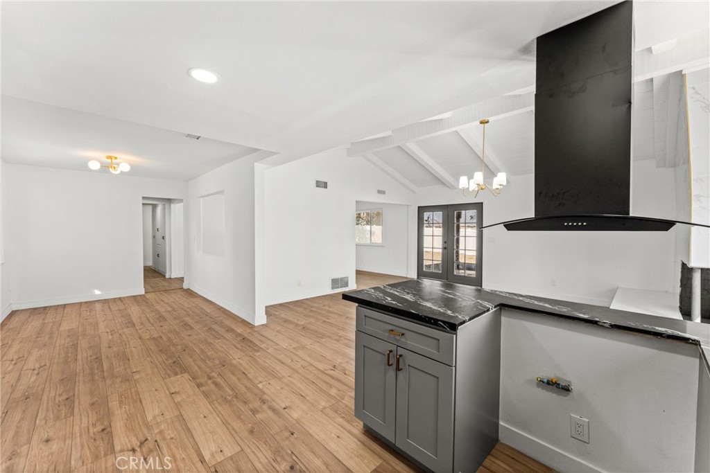 1423 Terrace Road Rialto, CA 92376 - Photo 18 of 40 a kitchen with granite countertop a sink and a stove top oven
