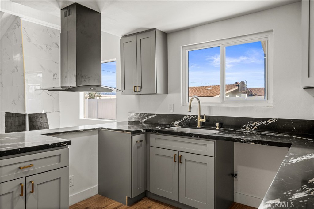 1423 Terrace Road Rialto, CA 92376 - Photo 19 of 40 a kitchen with a sink and cabinets