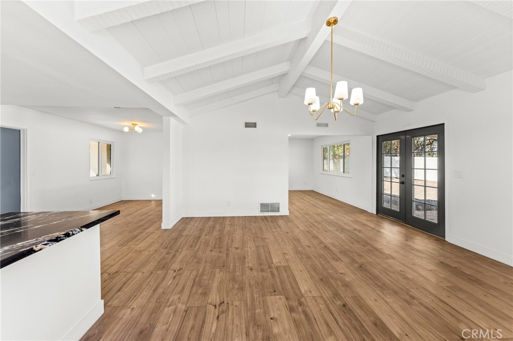 1423 Terrace Road Rialto, CA 92376 - Photo 20 of 40 a view of a livingroom with a chandelier fan and wooden floor