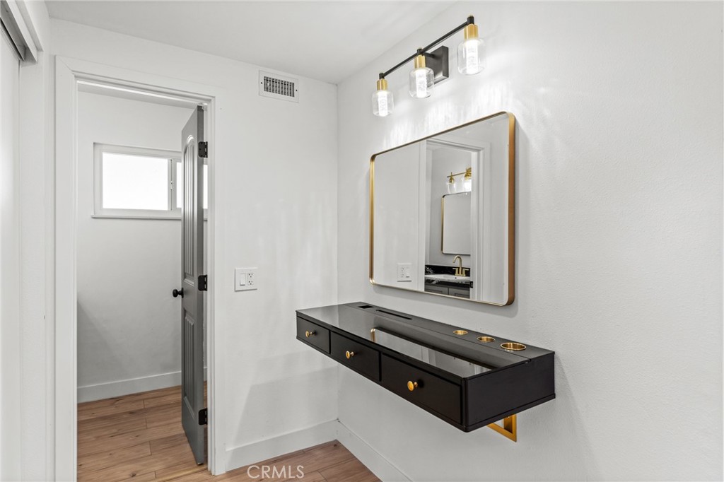 1423 Terrace Road Rialto, CA 92376 - Photo 24 of 40 a room with a bed and a mirror