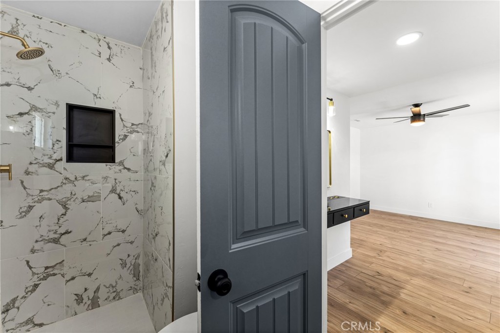 1423 Terrace Road Rialto, CA 92376 - Photo 26 of 40 a view of a bathroom with a sink and a mirror