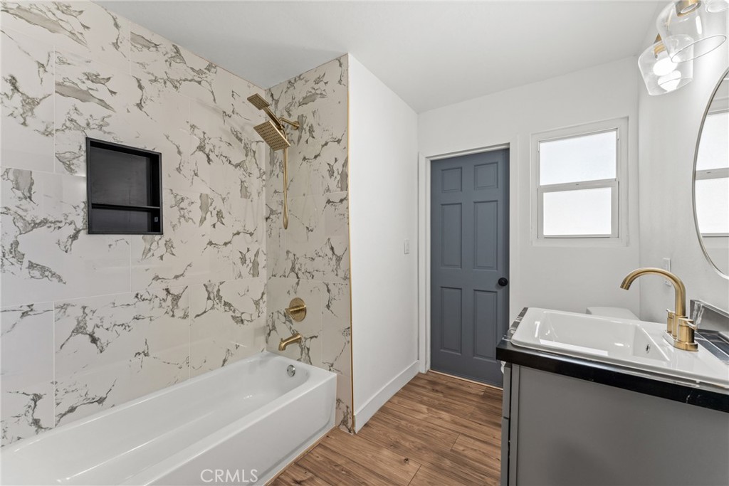 1423 Terrace Road Rialto, CA 92376 - Photo 29 of 40 a bathroom with a bathtub and a sink