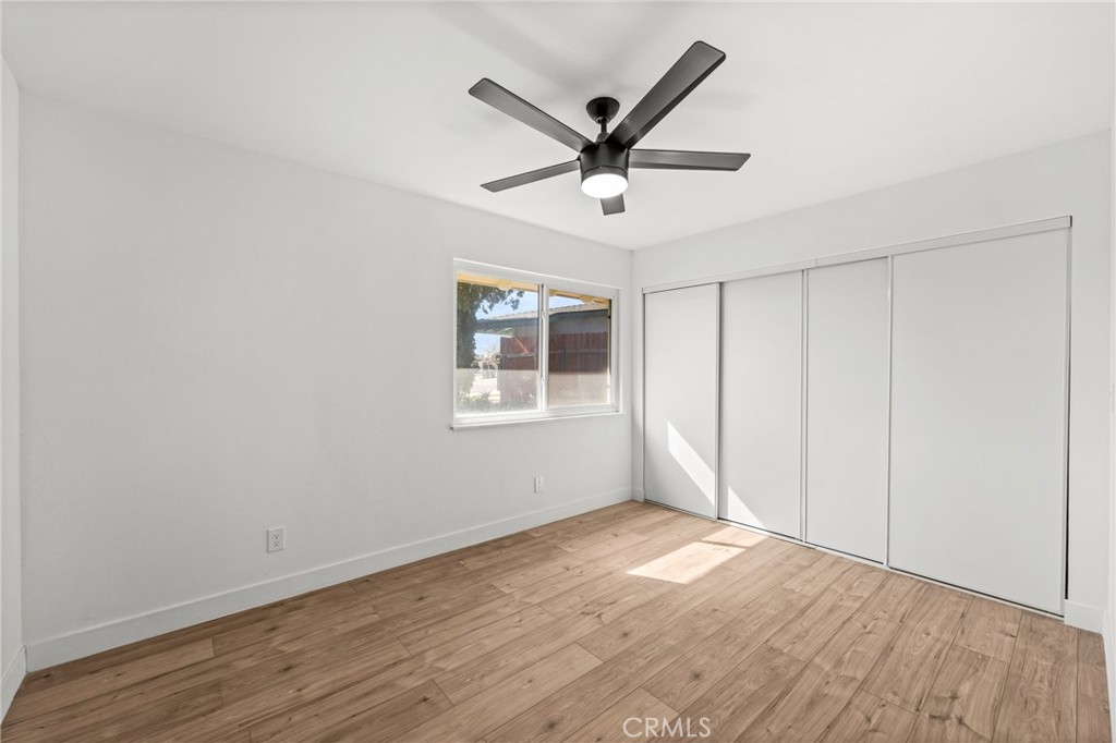 1423 Terrace Road Rialto, CA 92376 - Photo 31 of 40 a view of a big room with wooden floor and windows