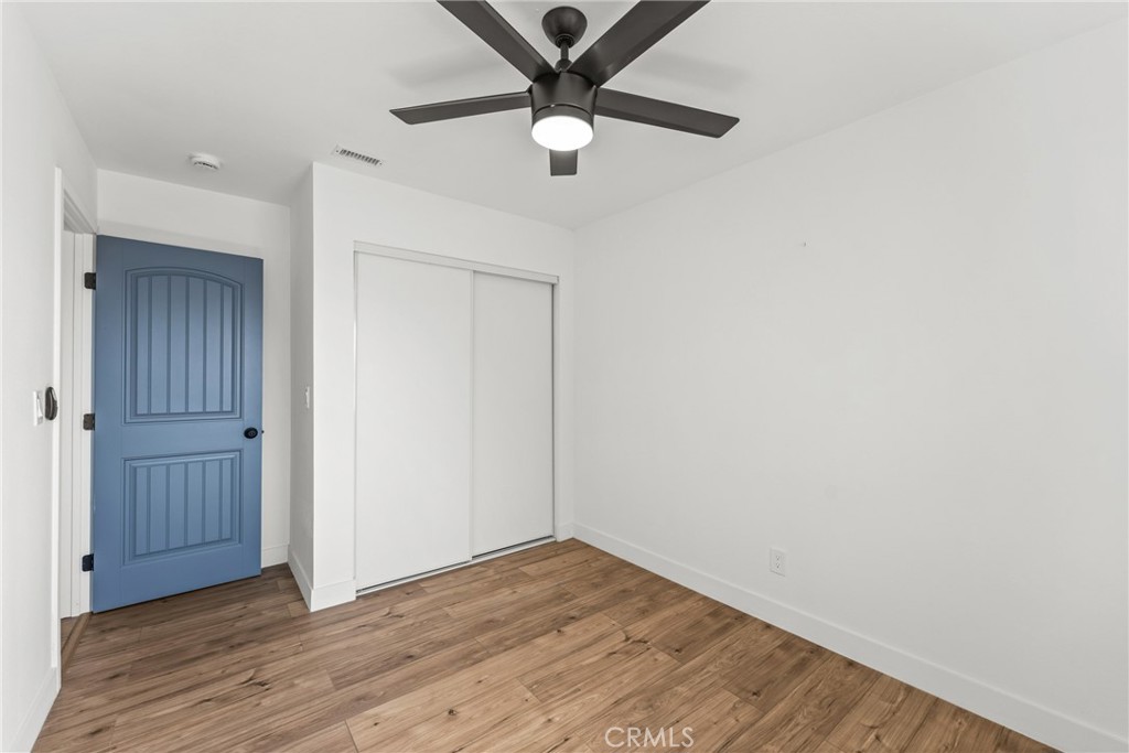 1423 Terrace Road Rialto, CA 92376 - Photo 35 of 40 a view of an empty room with wooden floor