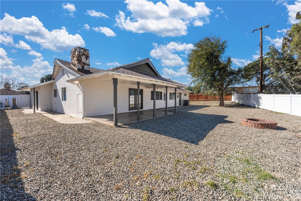 1423 Terrace Road Rialto, CA 92376 - Photo 37 of 40 a view of a white house with a yard