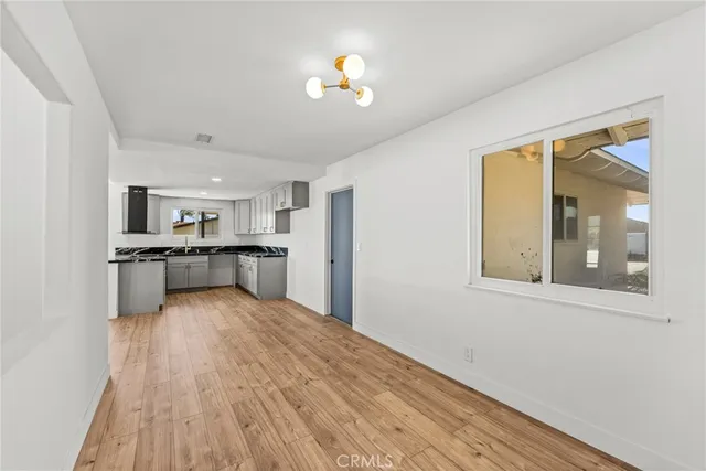 a view of kitchen with wooden floor