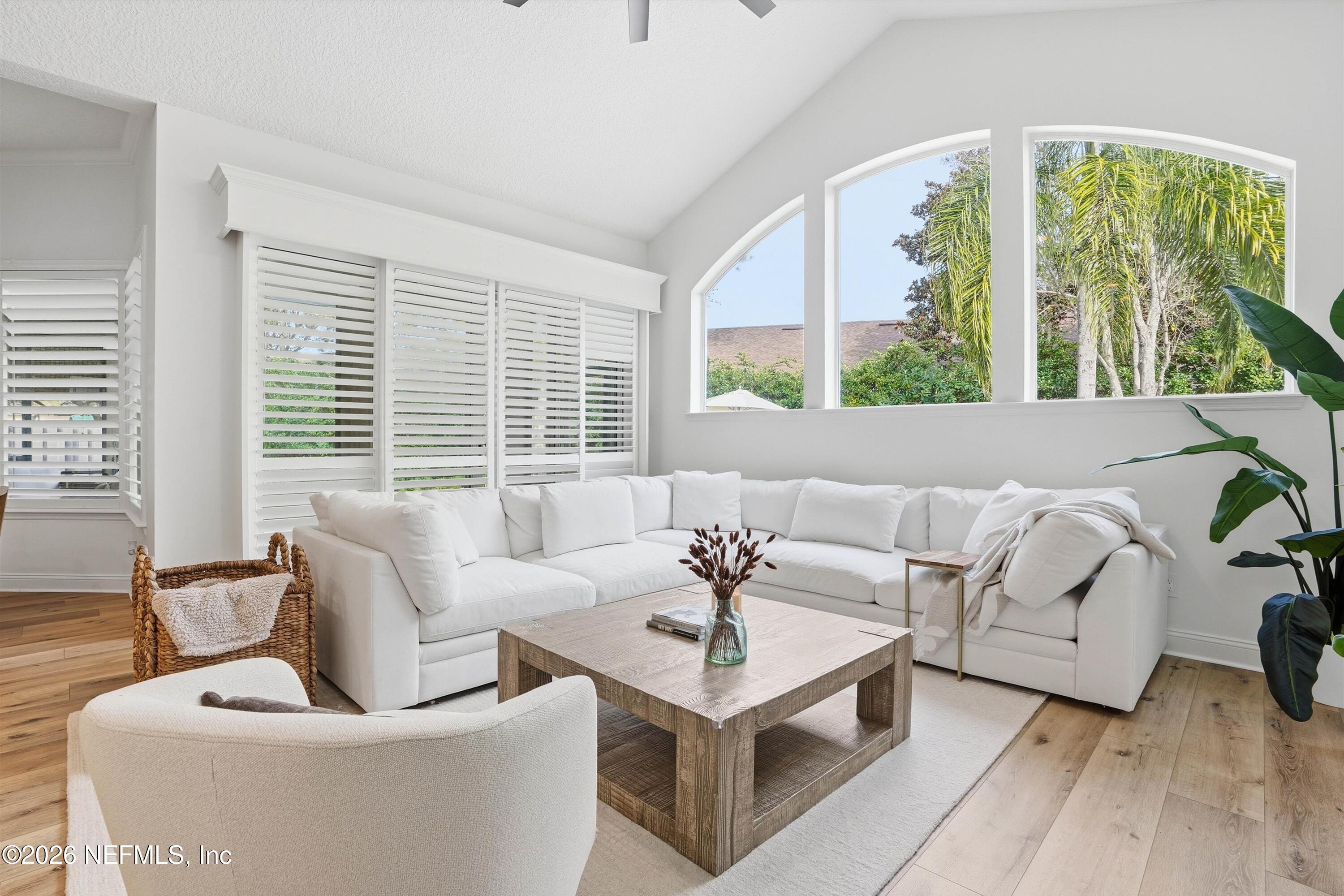 628 Pelham Road St. Augustine, FL 32092 - Photo 13 of 56 a living room with furniture and large windows