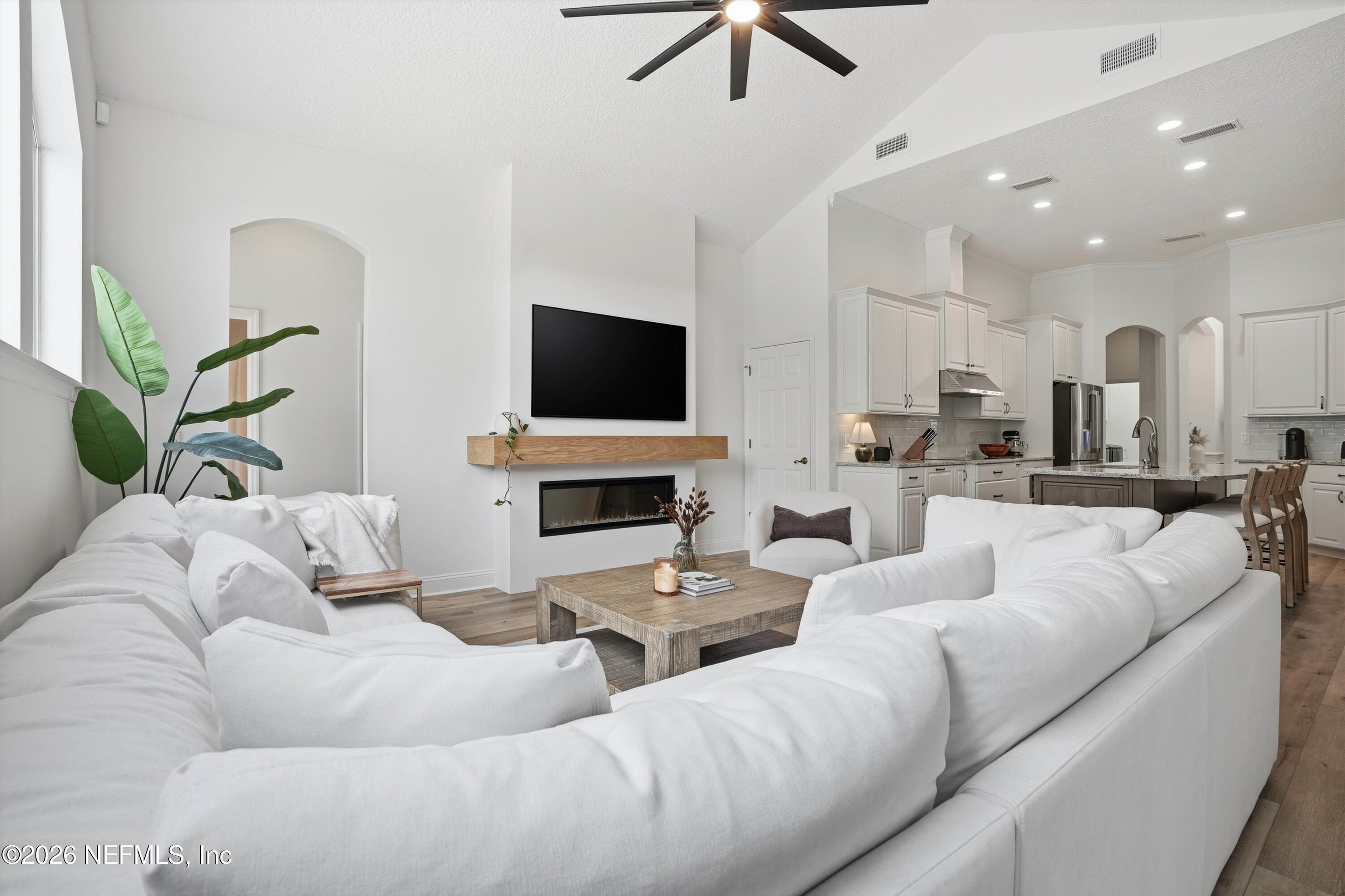 628 Pelham Road St. Augustine, FL 32092 - Photo 14 of 56 a living room with furniture and a flat screen tv