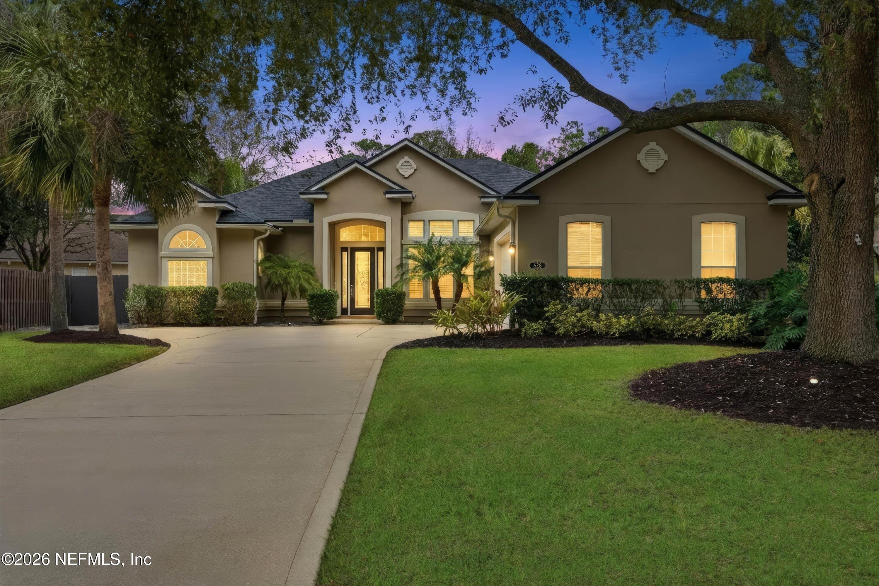 628 Pelham Road St. Augustine, FL 32092 - Photo 2 of 56 a front view of a house with a yard