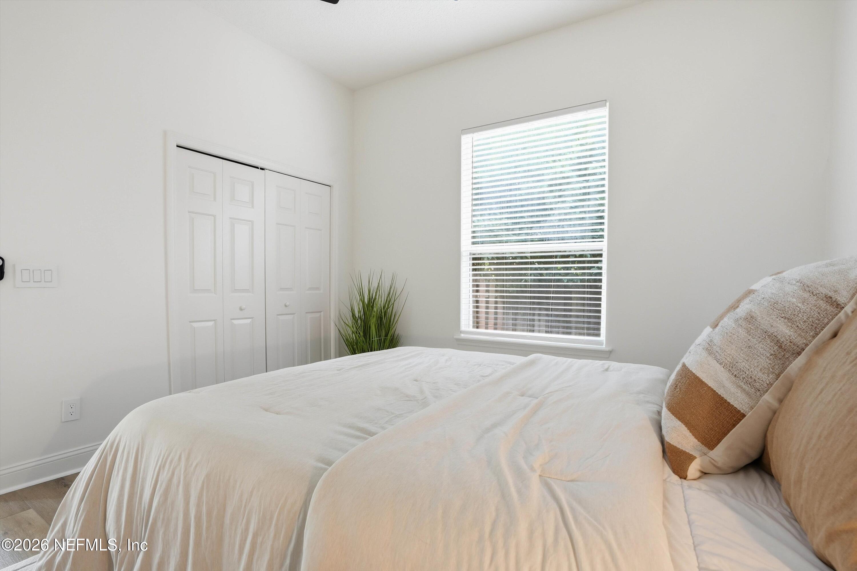 628 Pelham Road St. Augustine, FL 32092 - Photo 22 of 56 a bedroom with a bed and a window