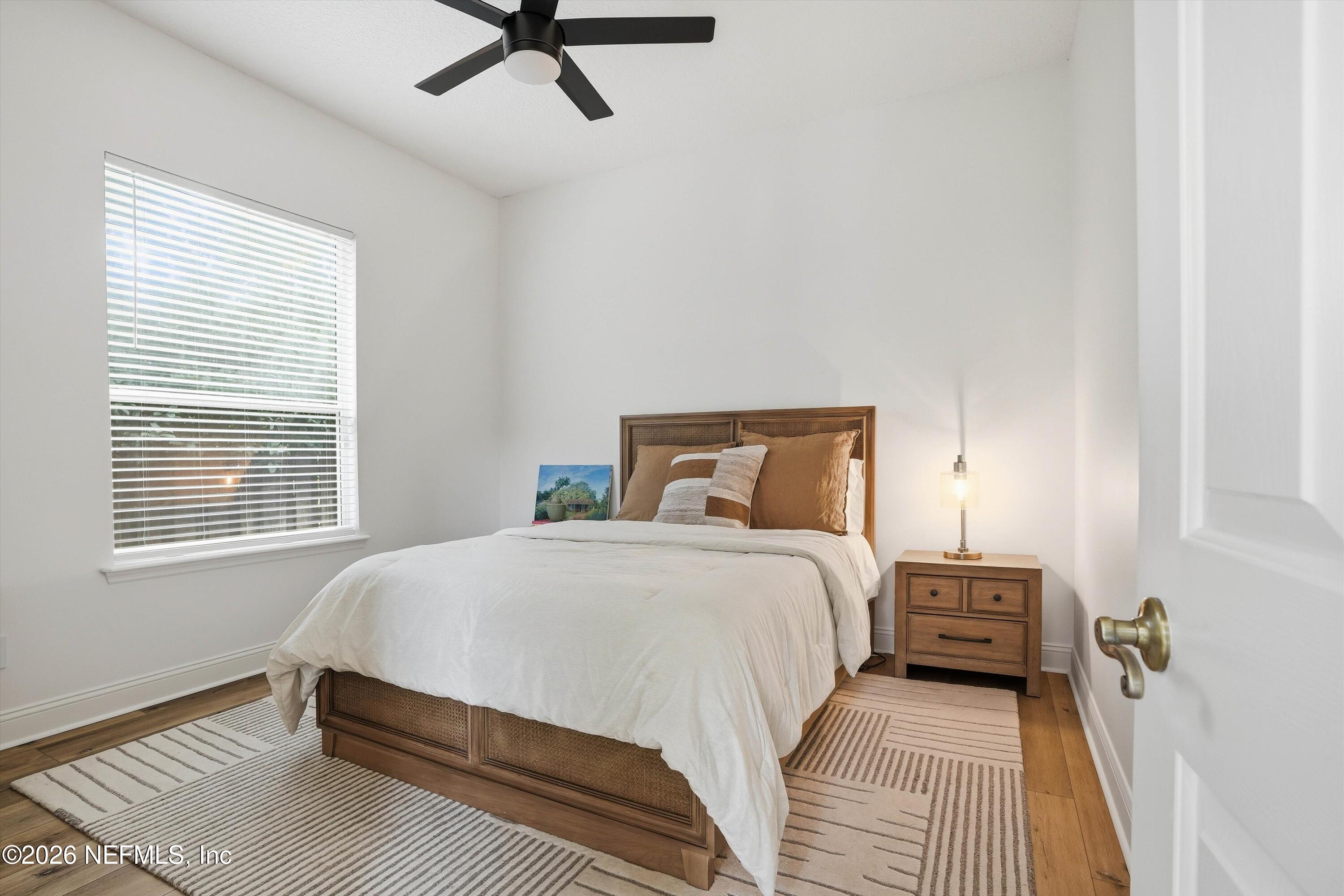 628 Pelham Road St. Augustine, FL 32092 - Photo 23 of 56 a bedroom with a bed and a window