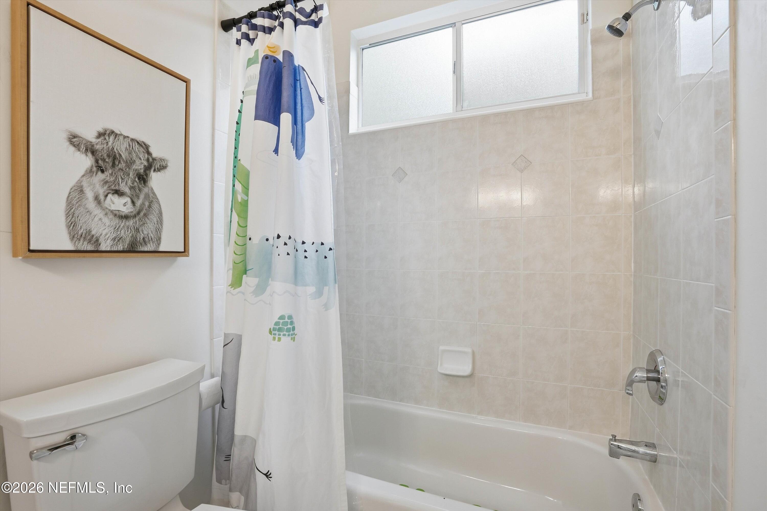 628 Pelham Road St. Augustine, FL 32092 - Photo 28 of 56 a bathroom with a shower and a toilet