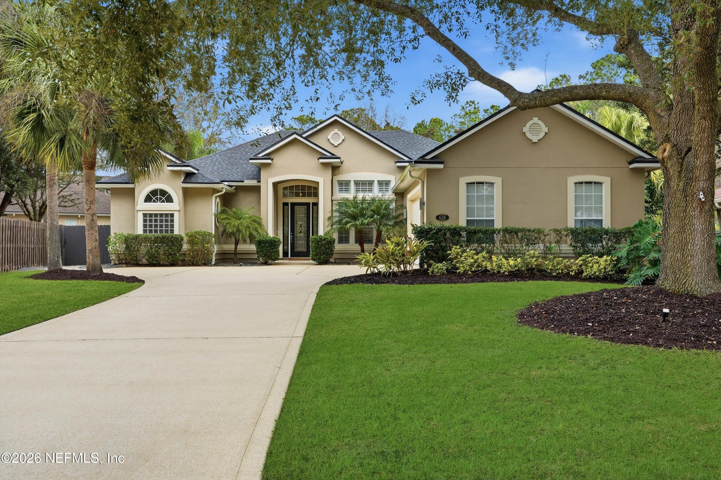628 Pelham Road St. Augustine, FL 32092 - Photo 3 of 56 a front view of a house with a yard